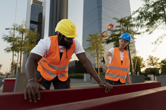 Construction workers planning urban development project outdoors
