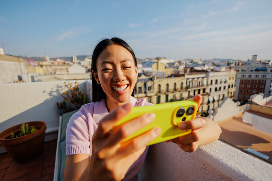 Woman enjoying video call on rooftop at home