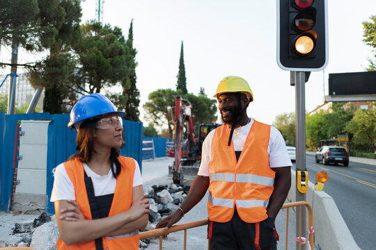 Construction workers planning development project at city street