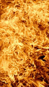 Vertical video Abstract orange fire flames background texture.