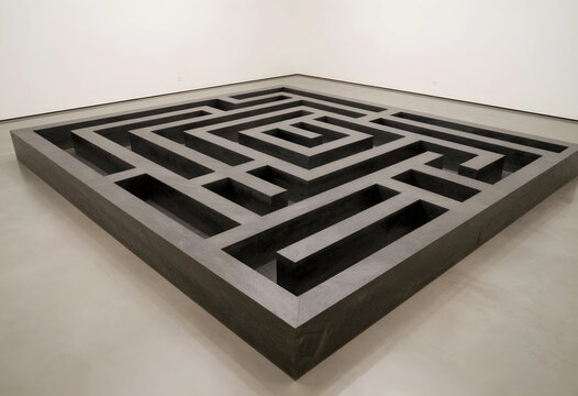 Complexity and problem solving, large black maze sculpture in a minimalist gallery space strategic thinking and difficult life challenges