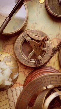 Vintage style travel and adventure. Vintage old compass and other vintage items on the table.