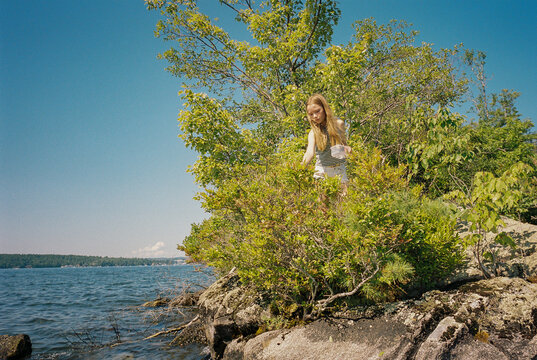 Young girl film portrait blueberry picking