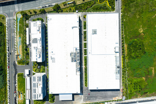 large modern factory buildings with white rooftops