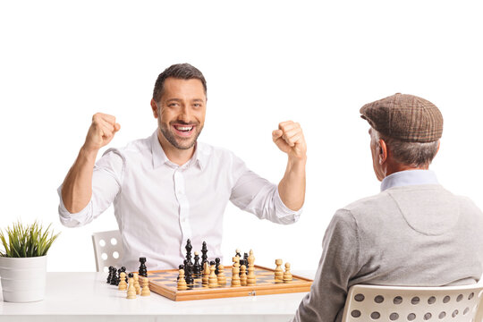 Happy man winning a chess game against a pensioner
