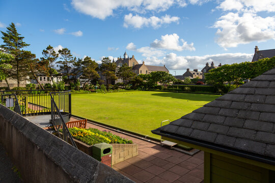 A game of crown green bowls in progress on the immaculate lawn in the centre of Lerwick, Shetland Islands, Scotland