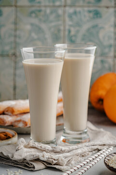Typical Valencian products Fartons, Refreshing cold drink Horchata, rice and oranges. Spain food from region Valencia.
