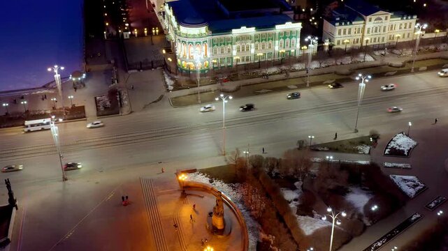 Ekaterinburg, Russia. House of Sevastyanov and Labor Square. The central street of the city is Lenin Prospect. Night city in the early spring. Drone footage