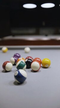 Billiard game with balls rolling over the pool table, vertical video, retro aesthetic, background with copy space