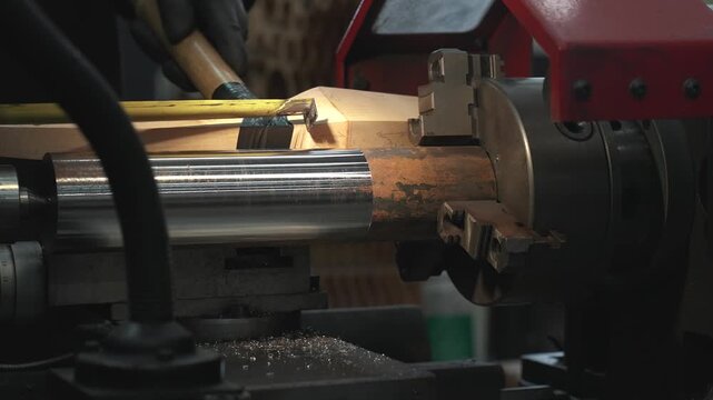 A time-lapse of the process of manufacturing a metal part from a blank on a CNC lathe using drills and cutting tools.