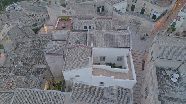 Aerial view of the historic stone buildings and rooftops of the Sassi di Matera in Matera, Basilicata, Italy.