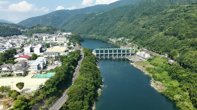 Aerial drone footage of river and weir in Miyoshi, Tokushima, Japan
