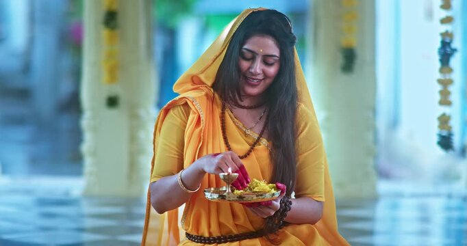 Indian Saint Mirabai Performing Aarti and Offering Prayers to Lord Krishna. Traditional Rajasthani devotional worship, Hindu temple rituals, and spiritual bhakti.