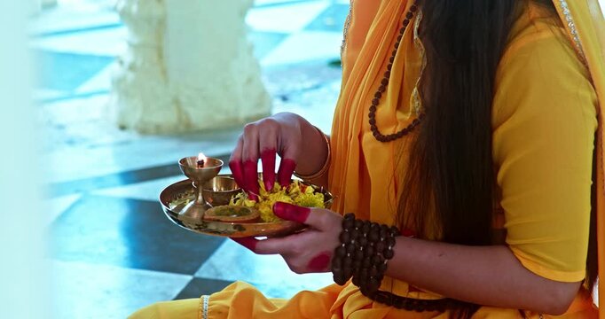 Indian Saint Mirabai Performing Aarti and Offering Prayers to Lord Krishna. Traditional Rajasthani devotional worship, Hindu temple rituals, and spiritual bhakti.