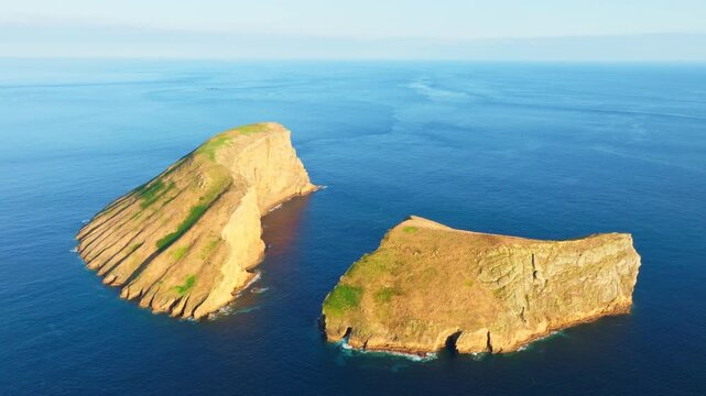 Cabras Islets and Atlantic Ocean at Sunset. Terceira Island, Azores, Portugal. Aerial View. Moving Forward, Tilt Down