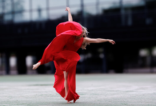 Dancer in Flowing Red Dress