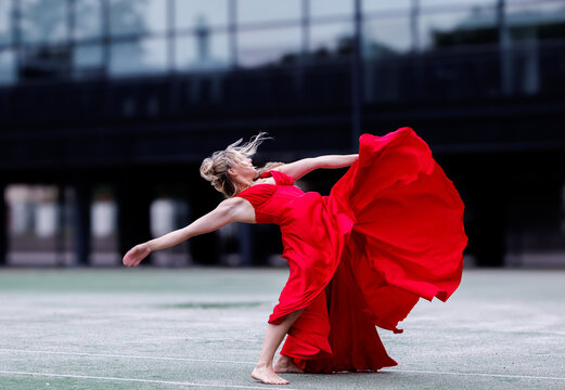 Dancer in Flowing Red Dress