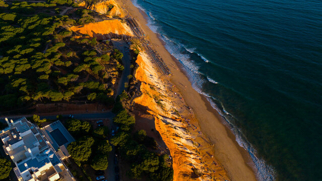 Aerial rocks and cliffs seascape shore view of famous Falesia beach, Algarve.