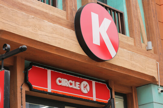 Circle K convenience store round logo and text signboard on a wooden facade at Vinpearl in Nha Trang, Vietnam on January 27, 2026.