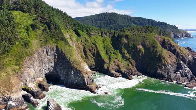 OREGON - 9.2.2026 - An aerial panorama of the Oregon coast ultimately reveals the Heceta Head Lighthouse.