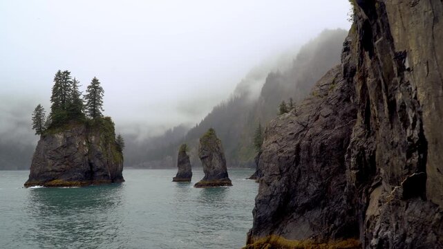 Rugged Sea Stacks and Forested Cliffs in Kenai Fjords National Park, Alaska