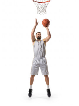 Basketball player shooting ball midair