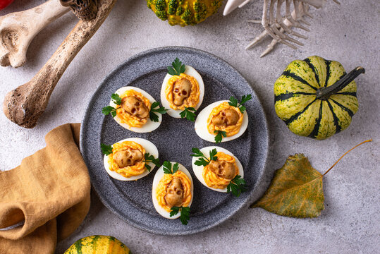 Deviled eggs decorated with skull Halloween food
