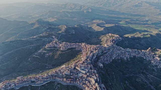 Aerial view of the unique star-shaped town of Centuripe nestled in the mountainous landscape of Sicily, Centuripe, Sicily, Italy.