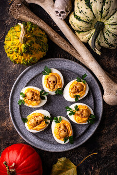 Deviled eggs decorated with skull Halloween food