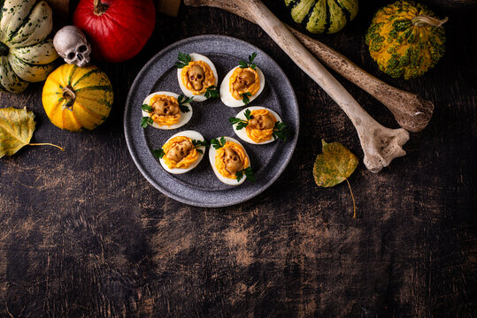 Deviled eggs decorated with skull Halloween food