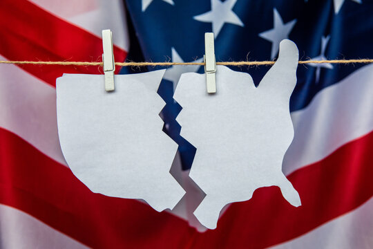 map of america USA is split with scissors - as a symbol of crisis and chaos of division in country