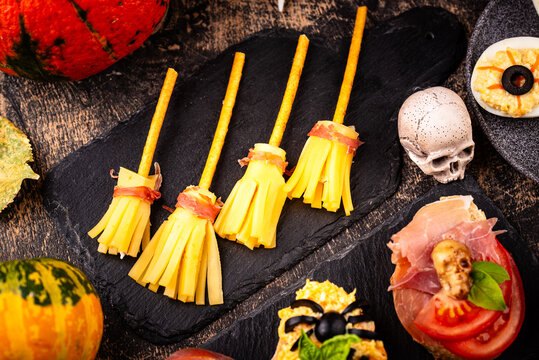 Halloween spooky snack in shape of witch broomsticks