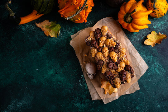Halloween pumpkin cake decorated with skull