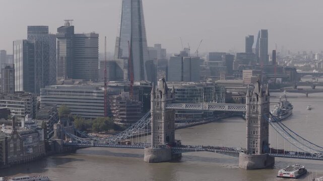 Establishing aerial view of Tower Bridge and The Shard in London. Iconic landmarks in the capital of the United Kingdom