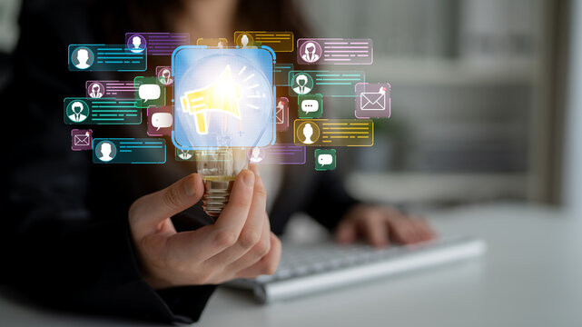 Innovative Marketing and Communication Concept with Lightbulb and Social Media Elements in Modern Office Setting. Entropy.
