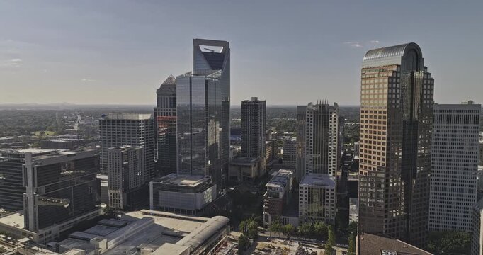 Charlotte North Carolina Aerial v122 flyover Second Ward in City Center capturing downtown cityscape with towering skyscrapers against cloudless blue sky - Shot with 5k Camera - Oct 1st 2023