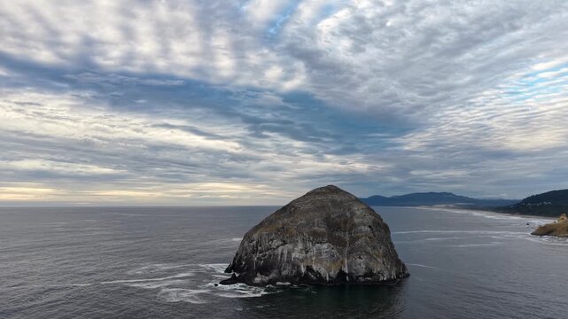 OREGON - 9.2.2026 - Terrific aerial footage starting to circle clockwise around Chief Kiawanda Rock, off the coast of Oregon's Pacific City Beach.
