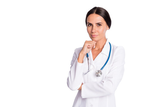 Photo of positive thoughtful young lady medic dressed uniform arm chin empty space isolated white color background