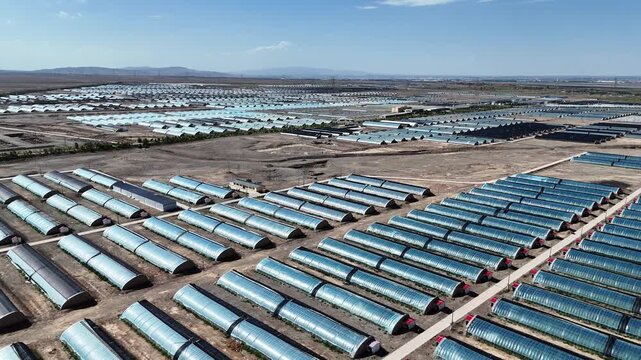 aerial view of neat rows of agricultural greenhouses
