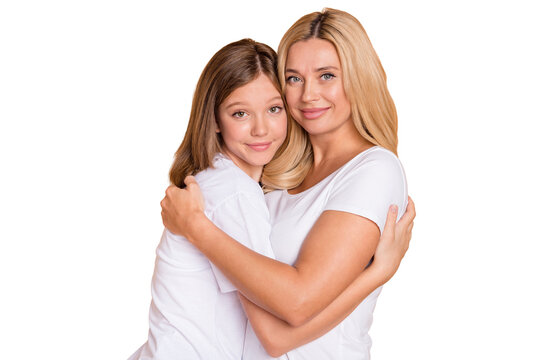 Photo of positive attractive woman and little girl hug harmony family isolated on pastel beige color background