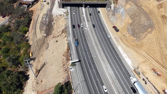 CALIFORNIA - 9.22.2026 - Very good aerial tilt up California's Highway 101, revealing the Wallis Annenberg Wildlife Crossing which is still under construction.