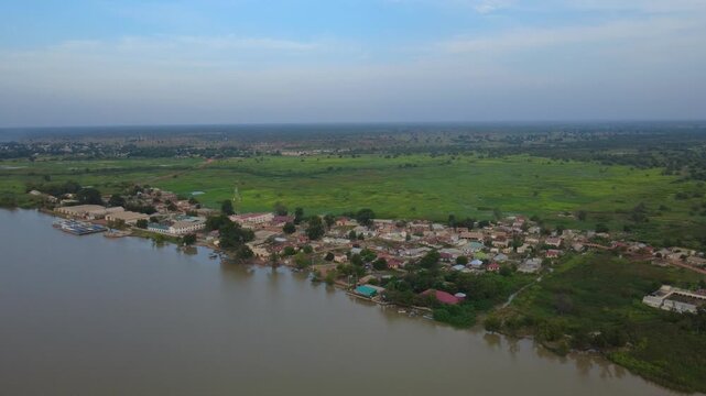 GAMBIA - 12.19.2025 - Good aerial footage lowering towards the village of Kuntaur on the Gambia River.