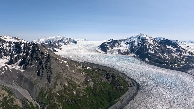 ALASKA - 9.3.2026 - Terrific aerial footage moving over a wintry path surrounded by snow-capped peaks in Alaska's Wrangell�St. Elias National Park and Preserve.