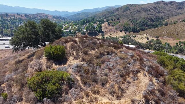 CALIFORNIA - 9.22.2026 - Stunning aerial footage rising above a hill by California's Highway 101 to reveal the Wallis Annenberg Wildlife Crossing, still under construction.