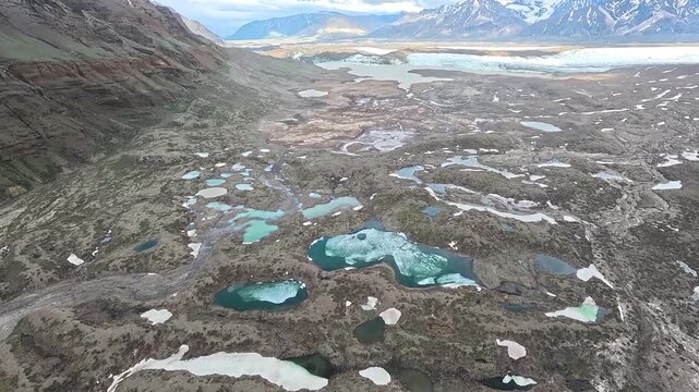 ALASKA - 9.3.2026 - Terrific aerial footage moving over icy pockets in an Alaskan valley.