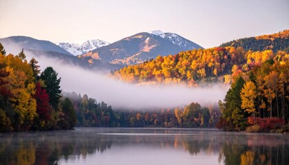 Obraz premium Scenic autumn mountains and lake with morning mist.