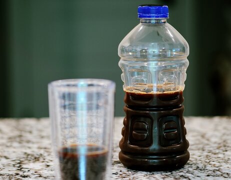 Middle aged man drinking prune juice to aide digestive health naturally - gut health constipation relief remedy aging gracefully preventive wellness