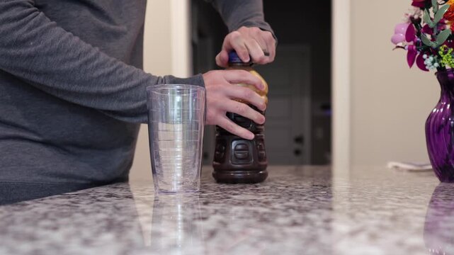 Middle aged man drinking prune juice to aide digestive health naturally - gut health constipation relief remedy aging gracefully preventive wellness