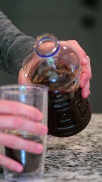 Middle aged man drinking prune juice to aide digestive health naturally - gut health constipation relief remedy aging gracefully preventive wellness