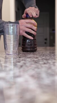 Middle aged man drinking prune juice to aide digestive health naturally - gut health constipation relief remedy aging gracefully preventive wellness